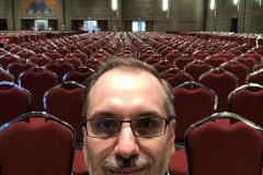 Craig sits in the empty main hall at FanX