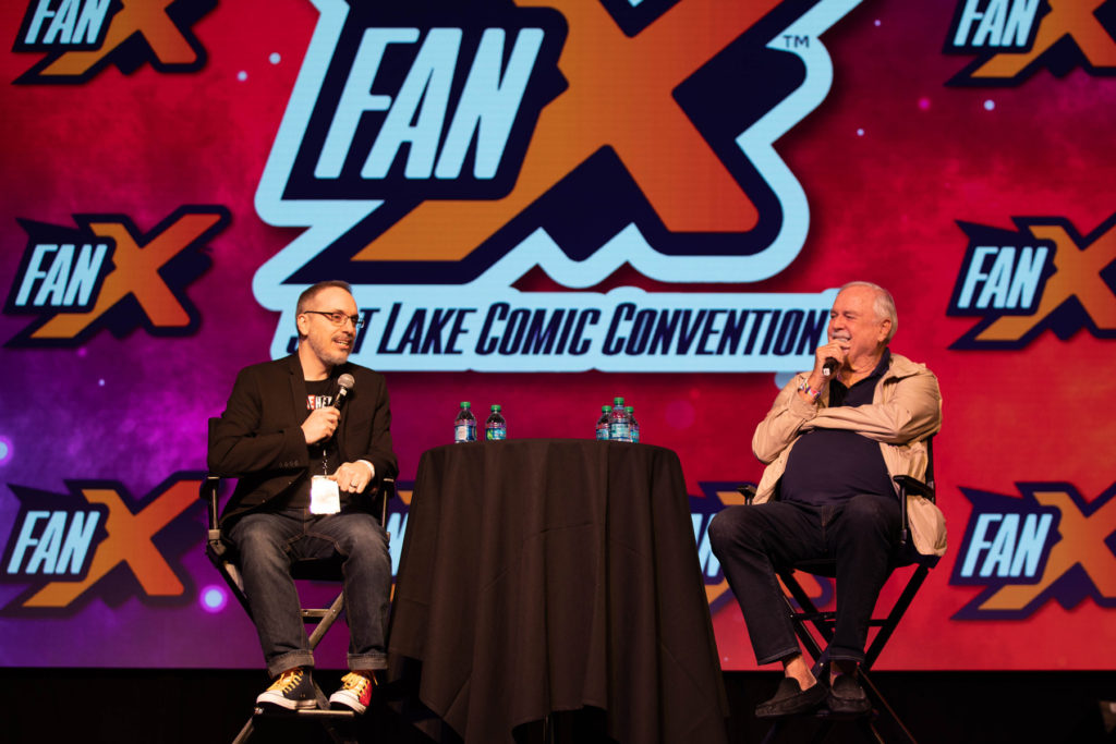 Craig Price moderating a live convention conversation with John Cleese